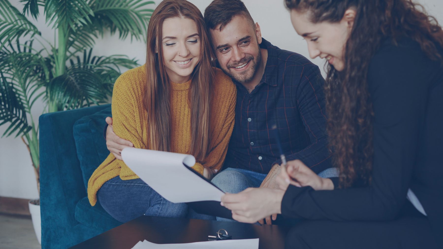 A couple talking through their options with an advisor at home